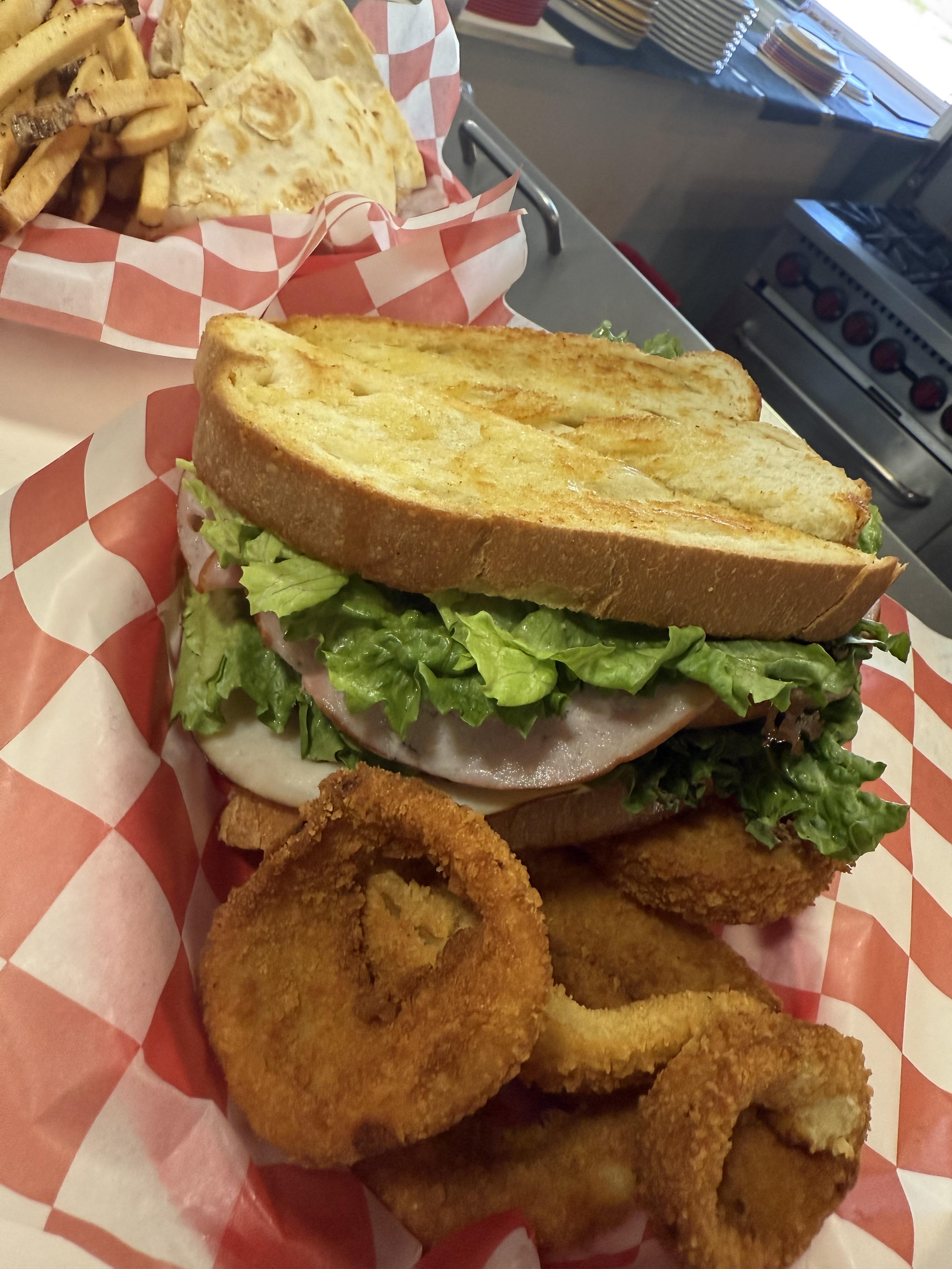 Hearty sandwich stacked high on a plate